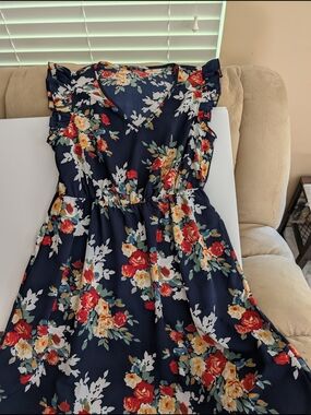 BloomChic Navy Dress with Red Floral Accents and flutter sleeves